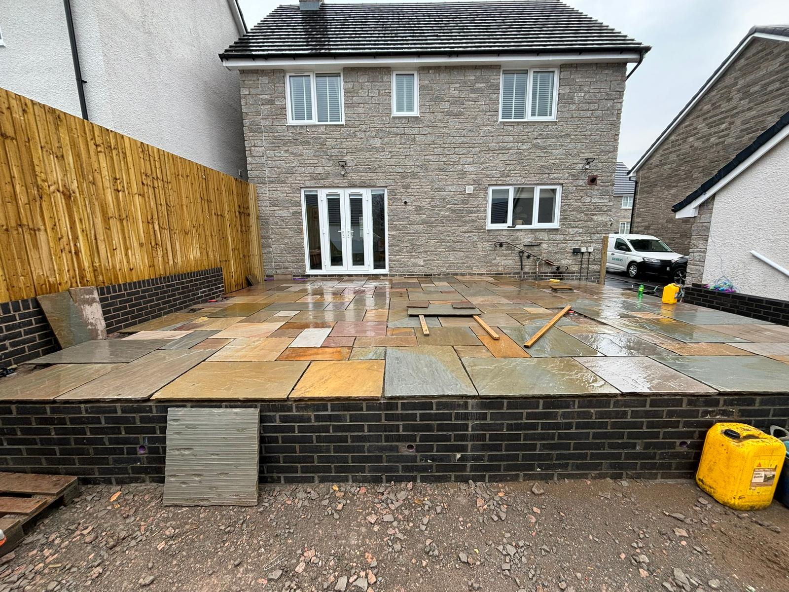 Raised sandstone patio on new brick retaining wall, Cynon Valley