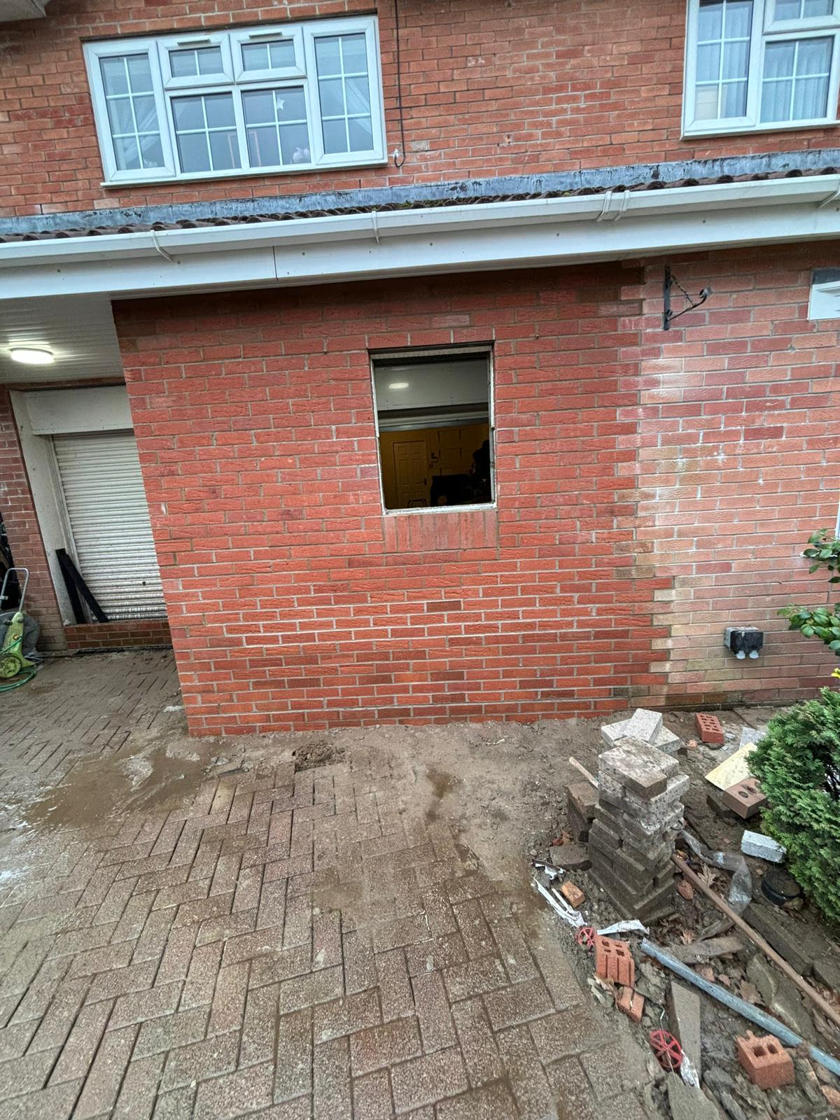 New window opening formed in brickwork on a brick extension